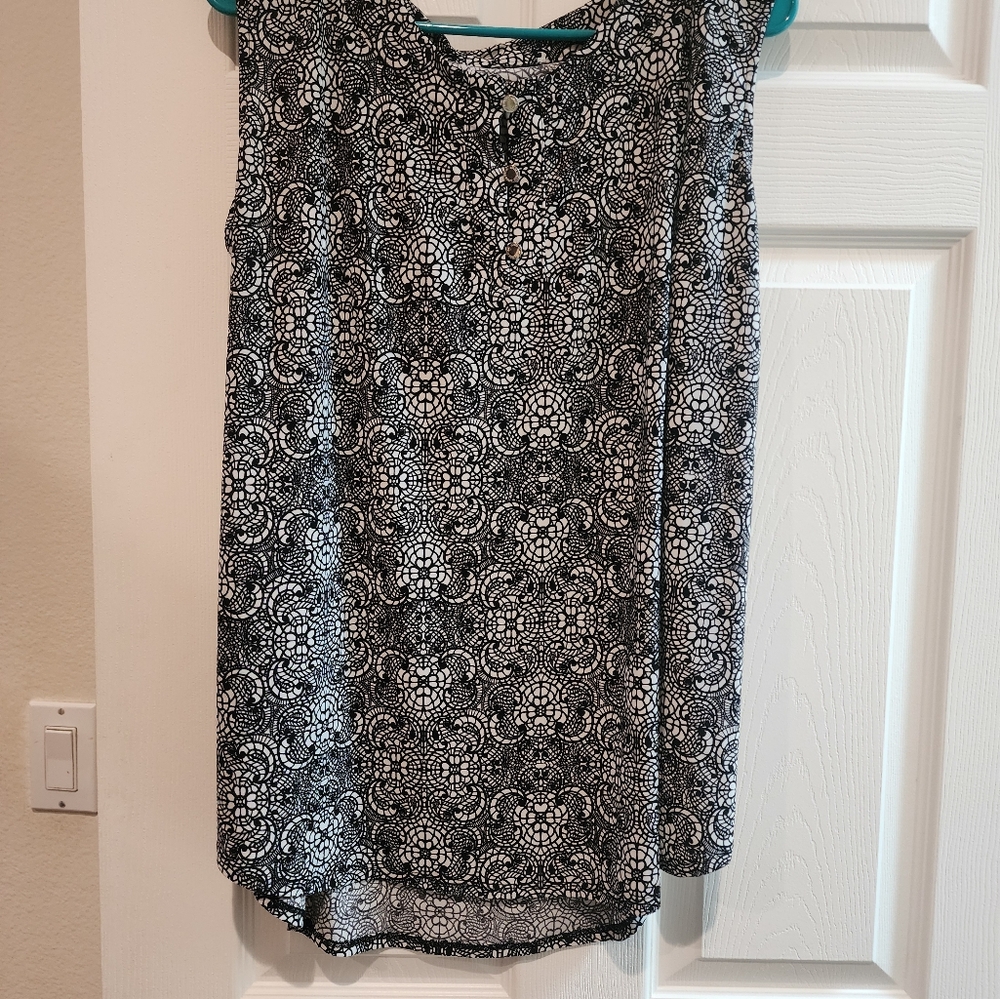 Black and white sleeveless blouse